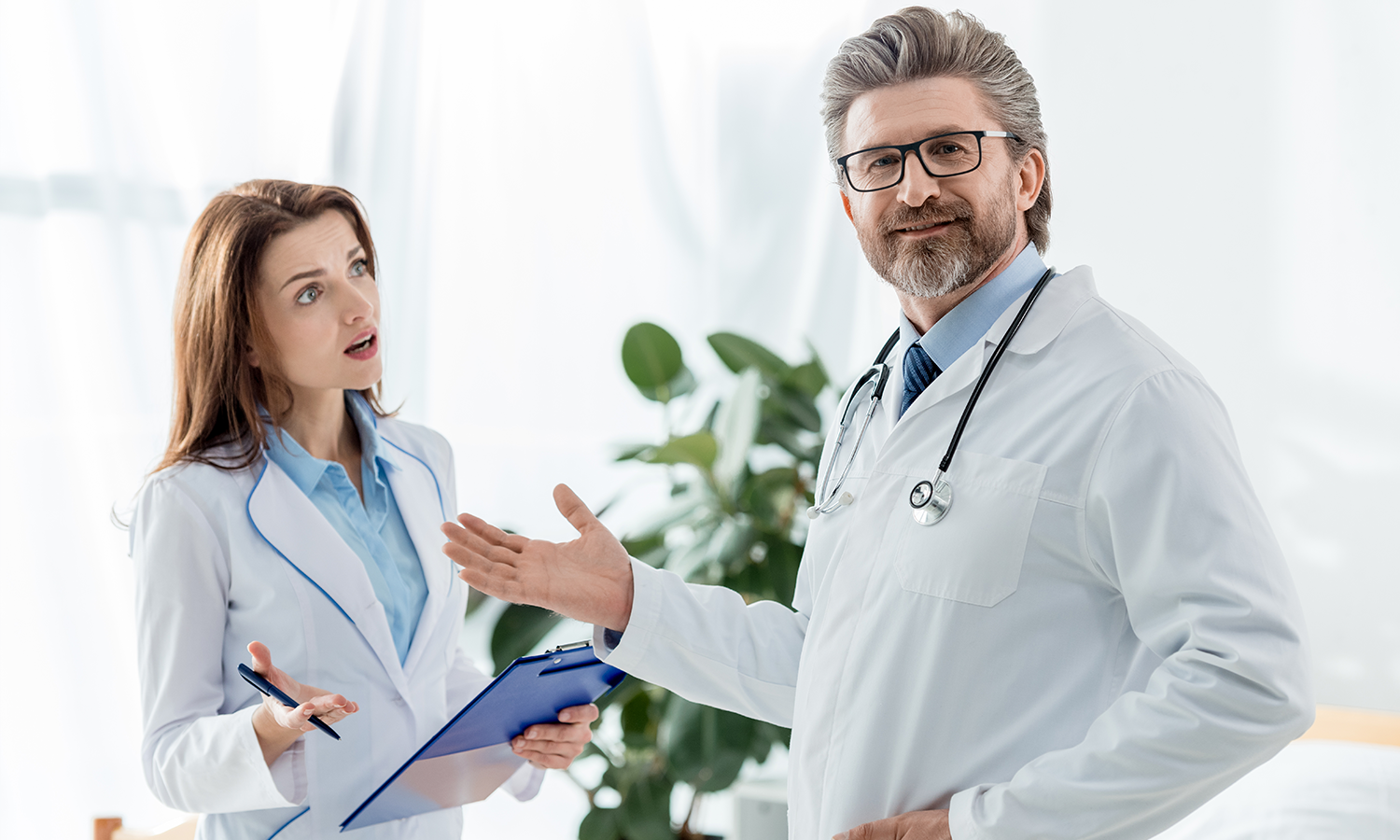 Two doctors reviewing cold laser therapy research, emphasizing medical credibility and evidence-based practice