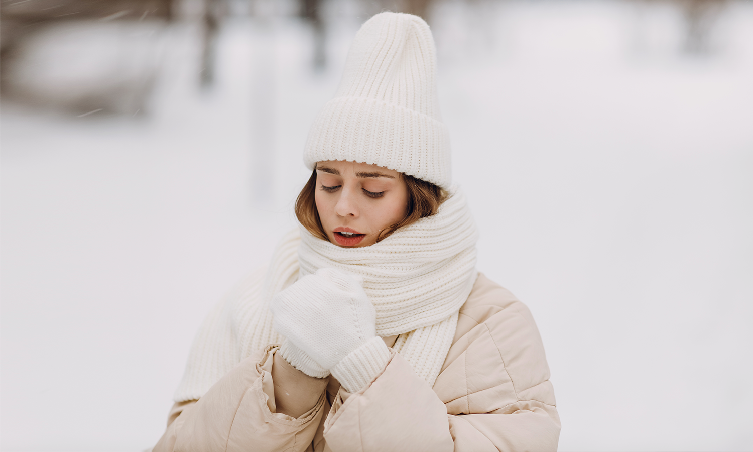 A person shivering in a cold environment symbolizing the misconception about cold laser therapy