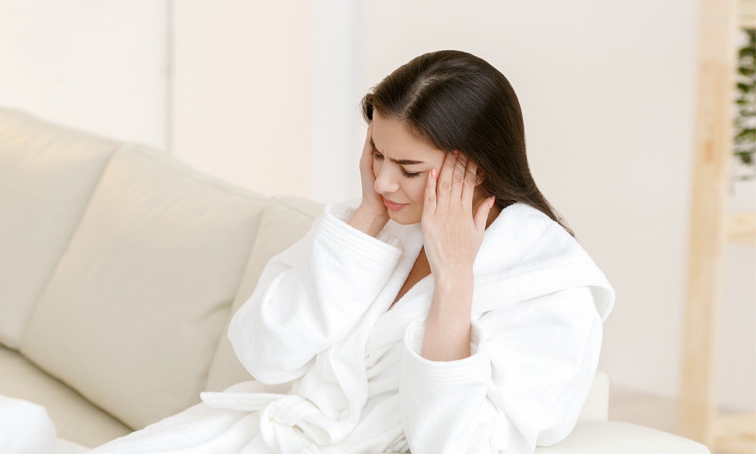 Woman with headache considering PowerCure cold laser therapy